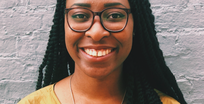 A profile picture of Yinka N. Bode-George (a woman with hair falling on her shoulders and wearing glasses)