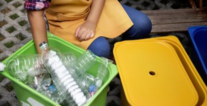 Closeup of hands separating plastic bottles