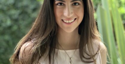 Image shows the profile picture of a woman with shoulder length hair smiling at the camera
